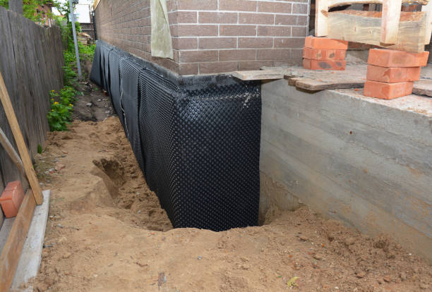 Happy homeowners after waterproofing job in Novi